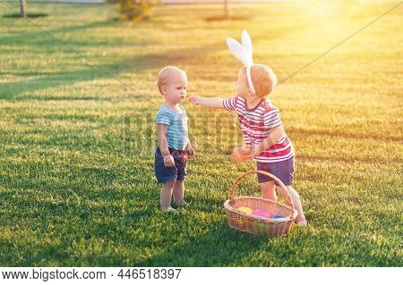 Toddler Eggs Hunters Close-up. Children Activity For Easter In Nature.
