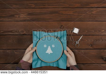 Embroidery Is In Female Hands, Flat Lay. Craftsperson Is Holding Pattern In Round Embroidery Frame, 