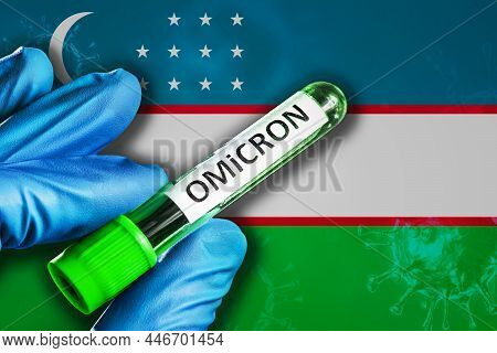 Uzbekistan Outbreak Of Omicron Variant. Hand Holds A Test Tube With Covid-19 Virus Omicron In Front