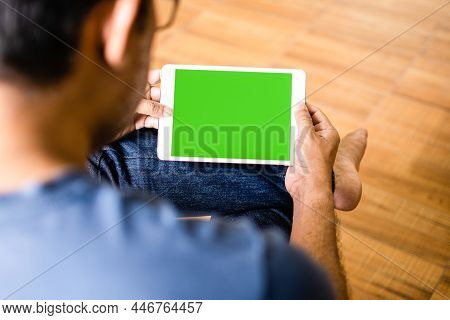Closeup, People Using The Tablet Device Home. Men Sitting Relaxed And Holding A Tablet Green Blank S