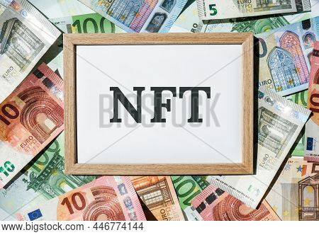 Nft Non-fungible Token Text. Concept Words Nft Non-fungible Token On Paper Blank. Background Of Euro