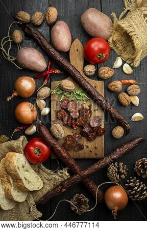 Smoked, Aged Sausages With Fresh Vegetables And Food Ingrediets On The Wooden Table. Flat Lay, Top V