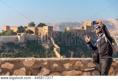 A Young Tourist At The Viewpoint Of Cerro San Cristobal De La Muralla De Jairan And The Alcazaba The