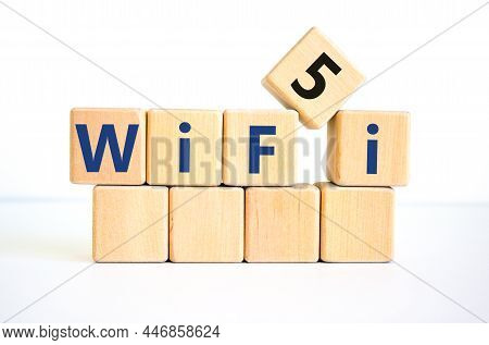 Wifi 5 Symbol. The Concept Word Wifi 5 On Wooden Cubes. Beautiful White Table, White Background, Cop