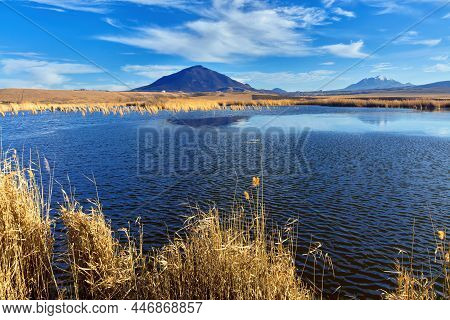 Nameless Lake On The Background Of Blue Sky And Mountains Of Caucasian Mineral Waters. The Bull And 