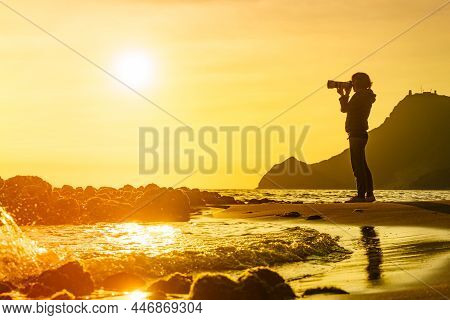 Tourist Woman With Camera Taking Travel Picture On Monsul Beach. Cabo De Gata Nijar Natural Park, Pr