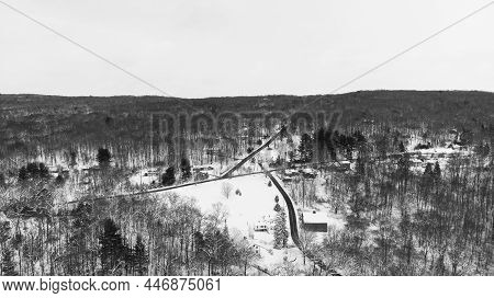 Aerial View Of Roads Seen In Black During Snow