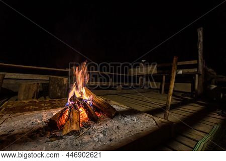 Bonfire With Sparks And Particles. Small Campfire With Gentle Flames In Night. Night Campfire With A