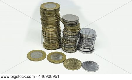 Indian Rupee Coins. Ten Rupees And Five Rupees Coins. And Two Rupees Silver Coin Stacked Vertically.
