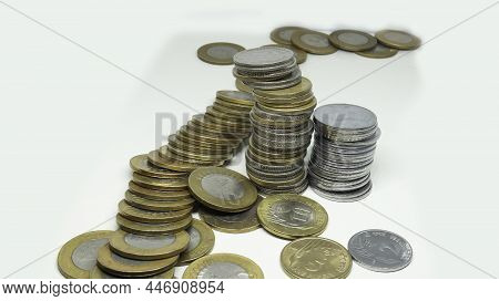 Pile Of Indian Rupee Coins. Ten Rupee And Five Rupee Coins And Silver Two Rupees Coin. On A White Ba
