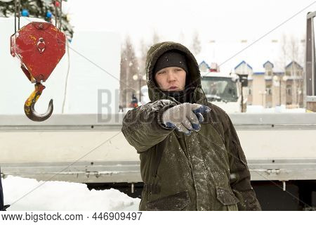Portrait Of A Fitter In A Green Jacket At The Hook