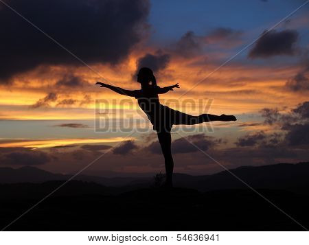 Ballet Arabesque in Silhouette on a Mountain Top