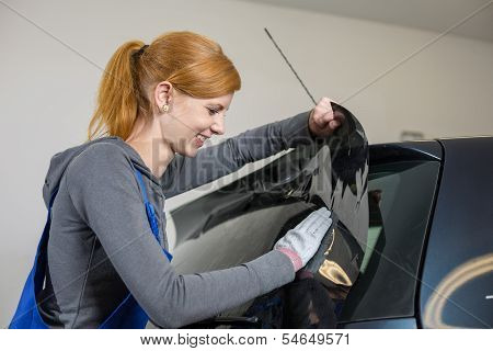 Car Wrappers Tinting A Vehicle Window With A Tinted Foil Or Film