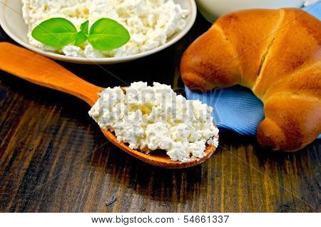 Curd On A Wooden Spoon On A Board