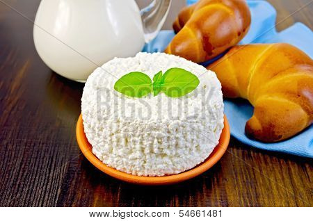 Curd With Basil And Bagels On A Board