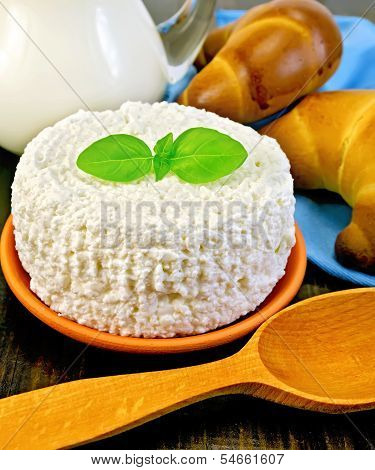 Curd With Milk And Spoon On A Board