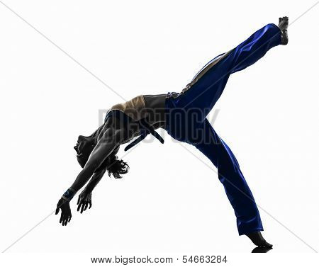 one caucasian woman capoiera dancer dancing in silhouette studio isolated on white background