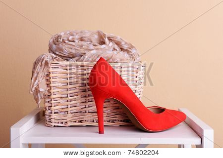 Red women shoes and scarf in room