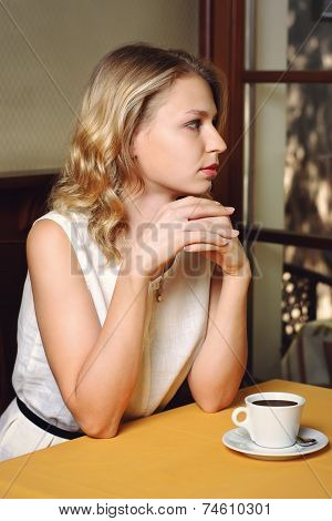 Girl In Cafe With Cup Of Coffee