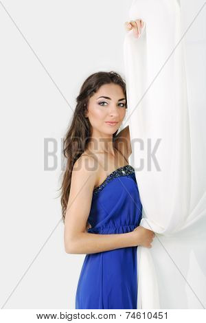 Girl Near Curtains Posing In Studio