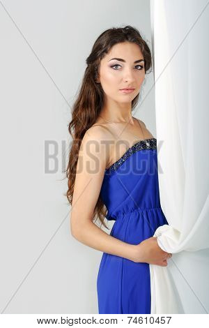 Girl Near Curtains Posing In Studio