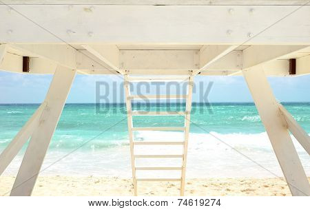 White Lifeguard House On A Beach