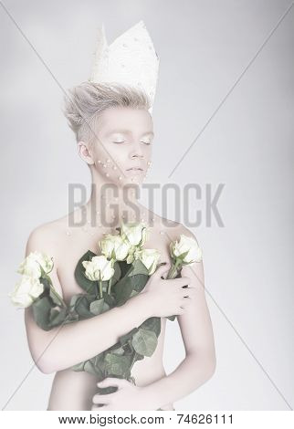 Artistry. Trendy Young Man In Paper Crown With Flowers