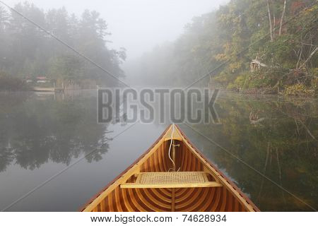 Canoe Bow On A Misty Autumn River