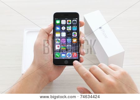 Man Unpacks A Box Of Iphone 6 Space Gray