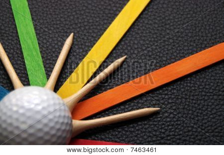 Golfové míčky a Tees