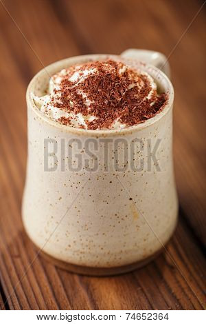 hot chocolat vintage mug, topping with cream and grated chocolate, shallow dof