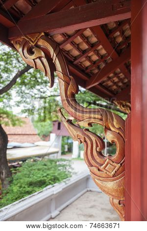 Golden wooden carving buttress in temple