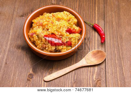 Couscous with vegetables on wood