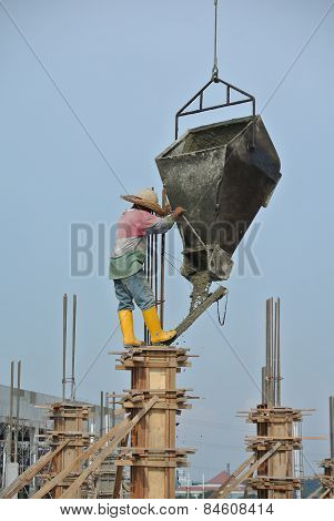 A construction workers casting building column