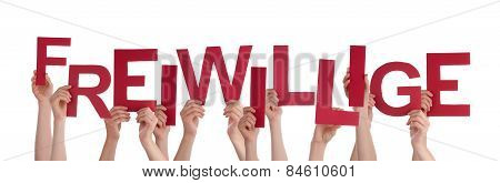 People Holding Red German Word Freiwillige Means Volunteer
