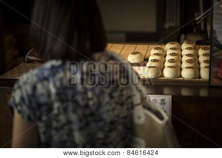 Traditional buns prepared for sale in Kyoto, Japan.
