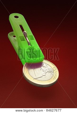 One Euro Coin In Green Clothespin Maw