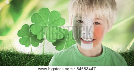 Cute irish boy against dew on the grass close up