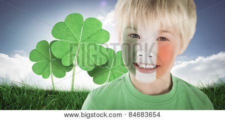 Cute irish boy against cloudy sky with sunshine
