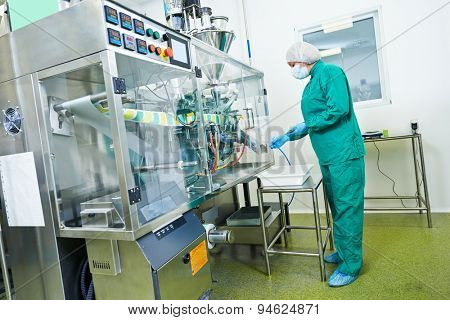 pharmaceutical factory woman worker operating production line at pharmacy industry manufacture factory
