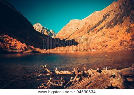Scenery Of High Mountain With Lake And High Peak On A Clear Day