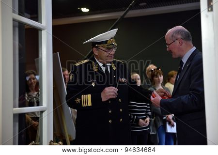 ST. PETERSBURG, RUSSIA - JUNE 24, 2015: Admiral Y. Sysuyev and vice president of Russian Geographical Society K. Chistyakov open the exhibition 