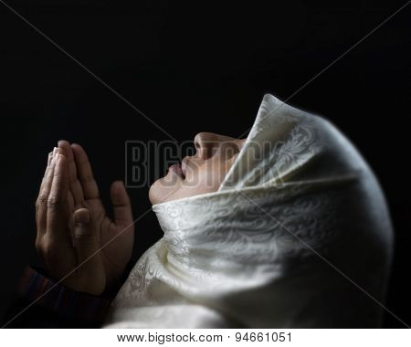 Muslim woman praying