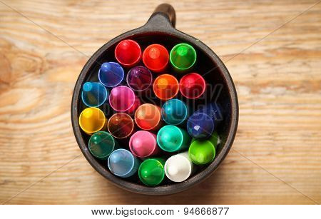 Crayons In A Mug On A Wooden Table