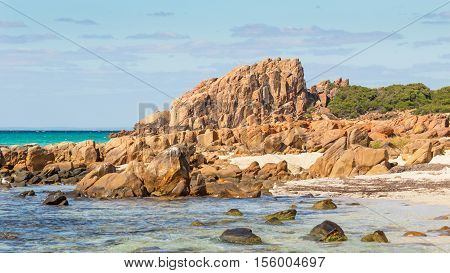 Castle Rock near Dunsborough in Western Australia is a massive chunk of orange granite standing tall at the end of beautiful Castle Bay.