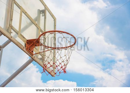 Basketball hoop on a blue sky in Thailnd .
