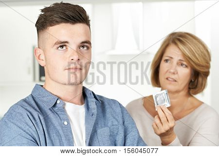 Mother Talking To Teenage Son About Contraception