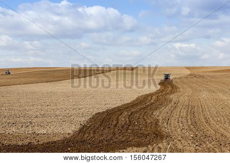 the agricultural field, which plowed into a tractor preparing the ground for planting. Spring