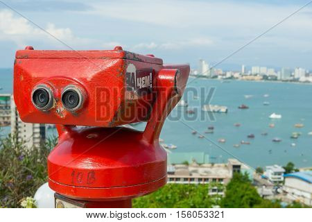 PATTAYA, THAILAND - 22 October 2016: Stationary observation binoculars at viewpoint Pratumnak Hill in Pattaya, Thailand.