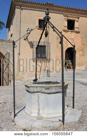Medieval water well in Saint Salvador church in Arta, Spain